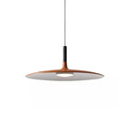 A medium orange Clérachic pendant on white, with a black stem on a thin cord and a round warm light below the shade.