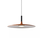 Large orange Clérachic pendant light on white, its wide disc shade with a black stem and a pale underside.