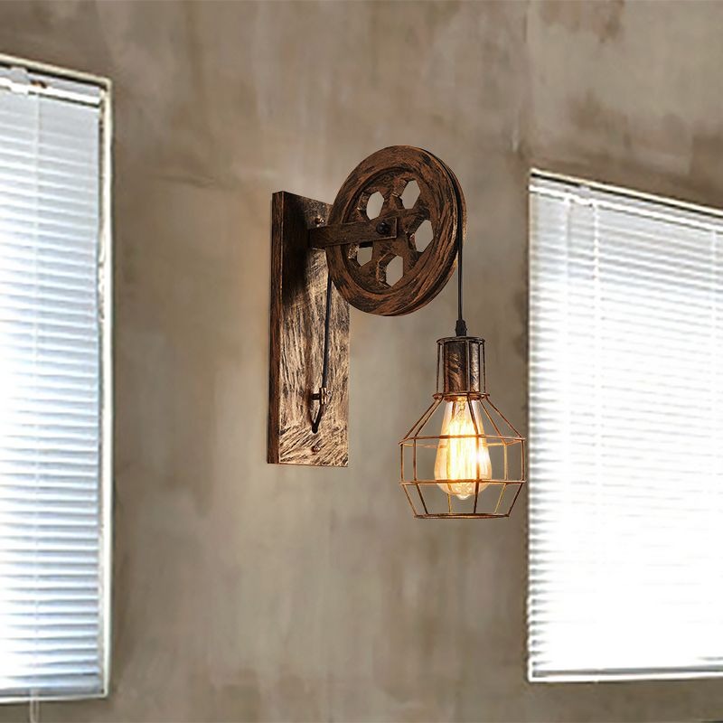 Clérachic pulley sconce on a concrete wall between two windows fitted with white blinds.