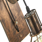Detail of the Clérachic sconce timber-look plate, screw fixings and the cage bulb holder.