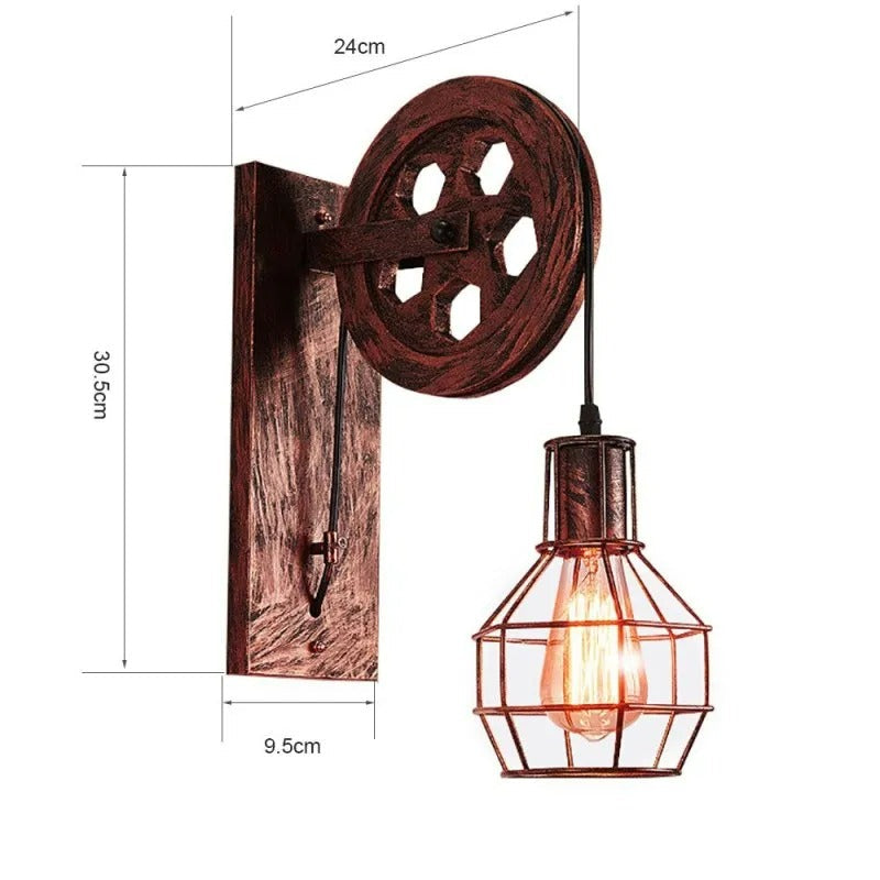Dimension drawing of the Clérachic pulley sconce in the red-brown finish with a lit bulb.