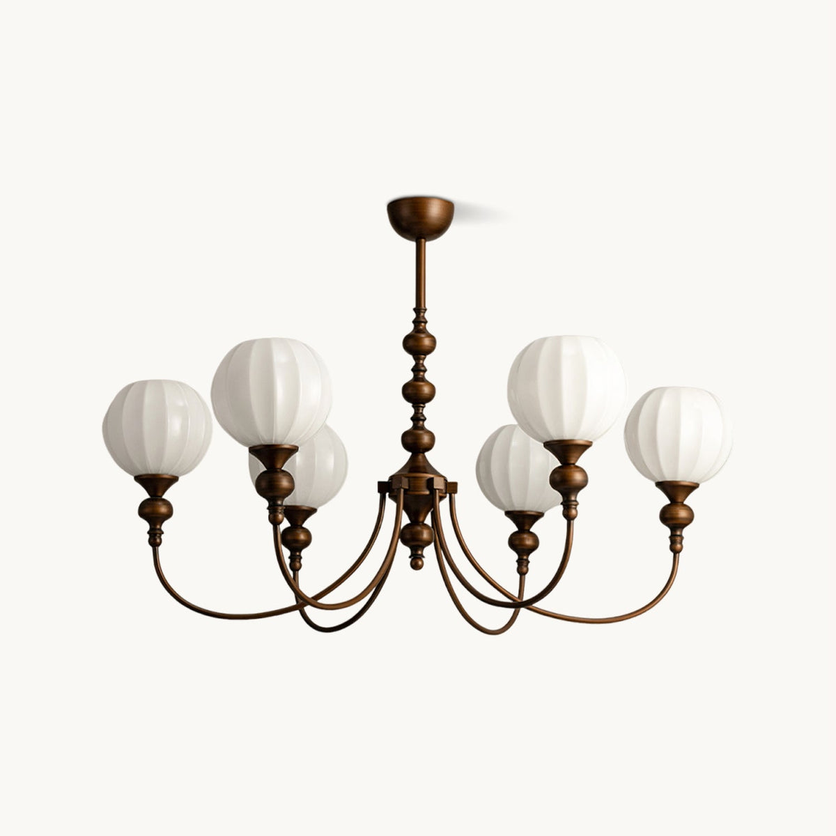 A six-light Clérachic chandelier with ribbed white glass globes on arched antique bronze arms, on a plain white backdrop.