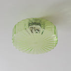Close view of the pale green ribbed glass and the chrome fitting reflected inside this Clérachic ceiling light.