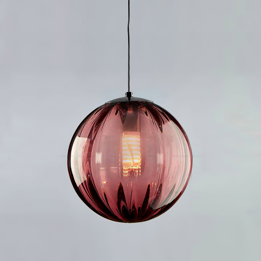 Wine red Clérachic glass pendant with ribs and a black cap, a lit bulb inside, on a pale grey backdrop.