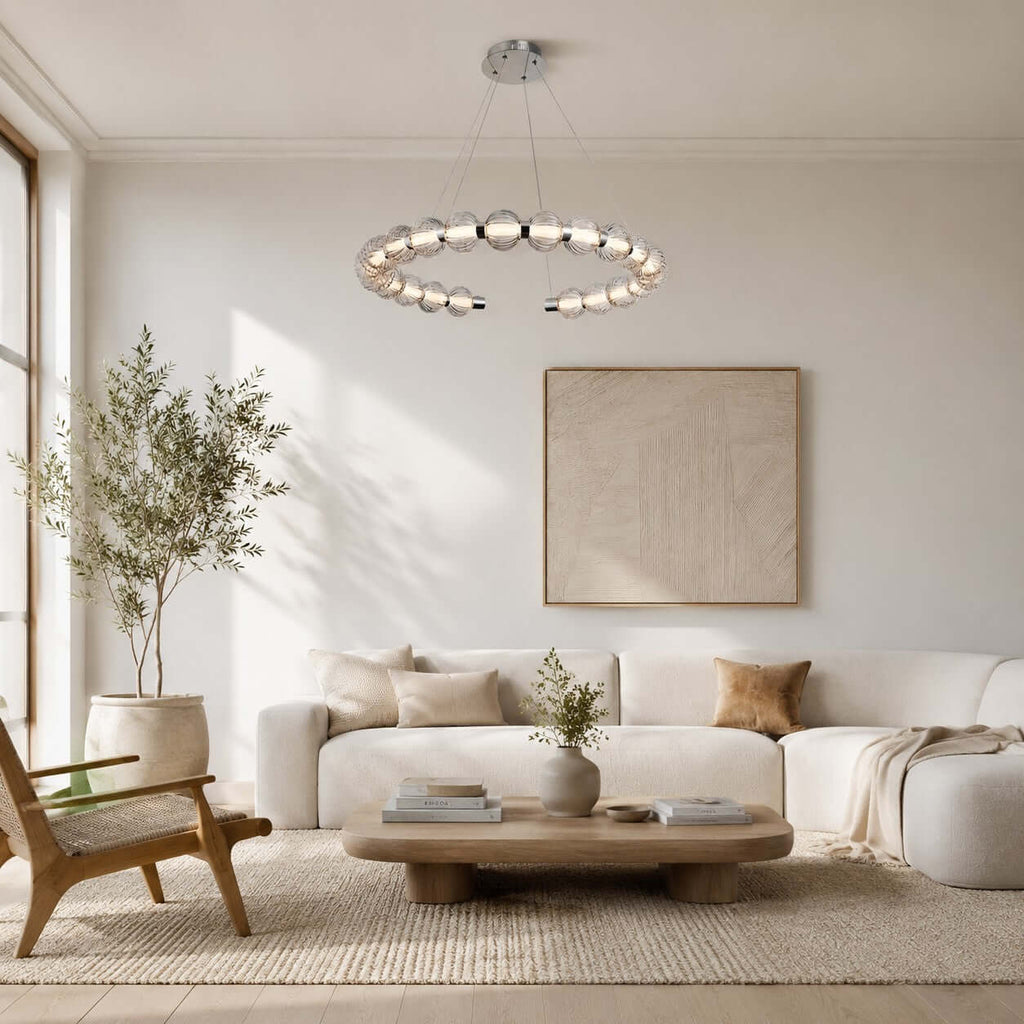 Hung over a living room with a curved cream sofa and a low wood coffee table, this Clérachic pendant ring glows softly.