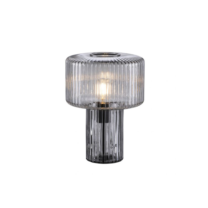 Smoky grey ribbed glass Clérachic table lamp with a black socket visible through the base, on a plain white backdrop.