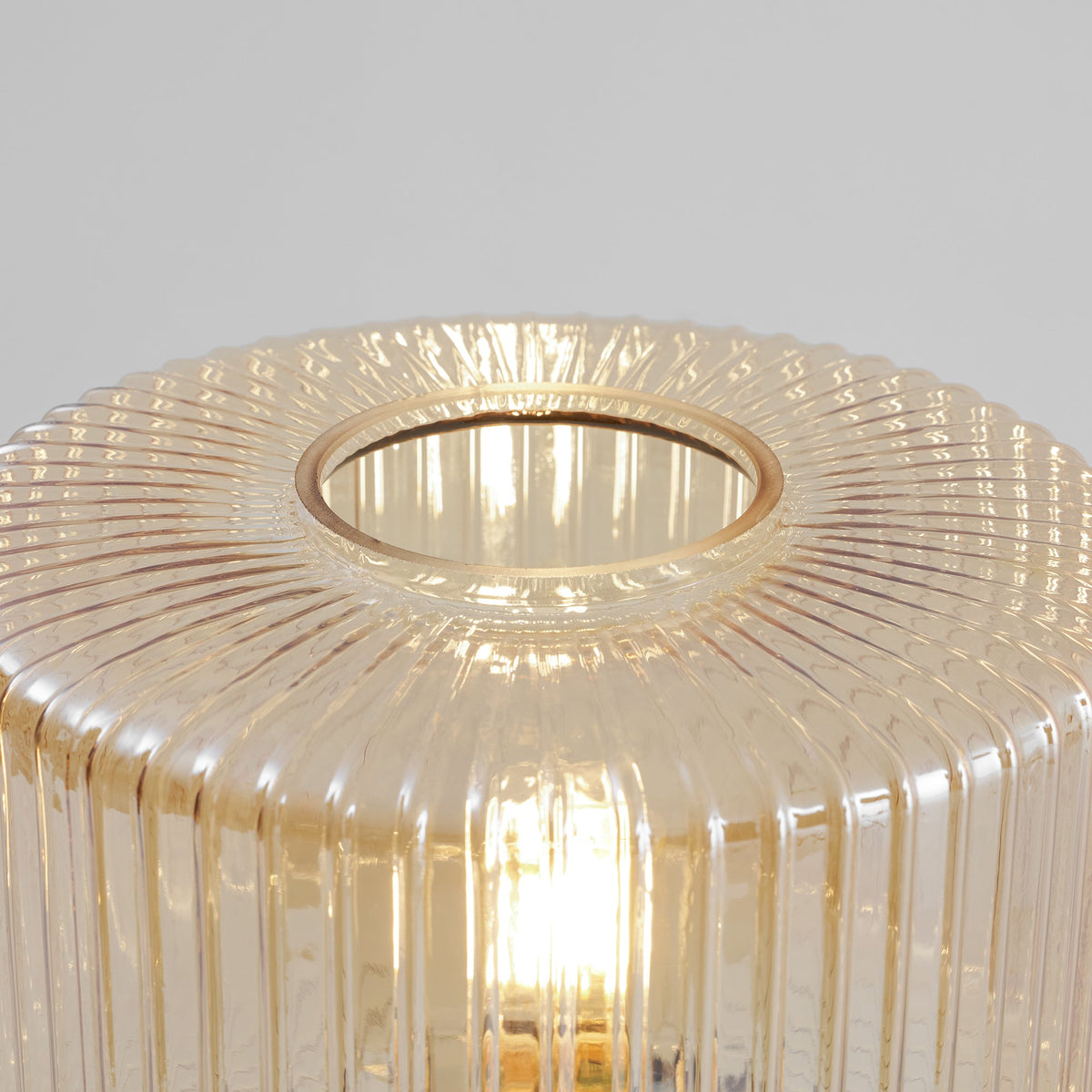 Close view of the fine vertical ribs and open top rim of the cognac glass shade on this Clérachic table lamp.