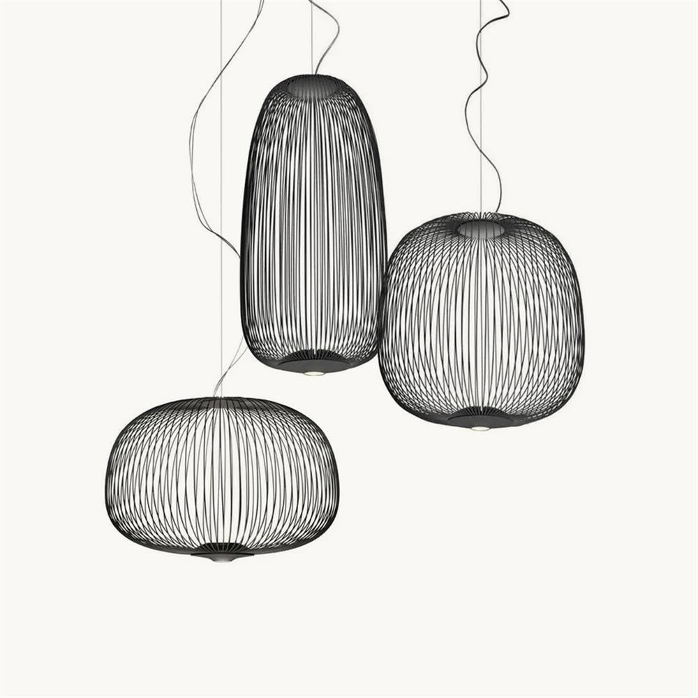 Three ribbed wire-cage pendants in black, in a tall oval, a wide dome and a low drum shape, hung as a cluster, from Clérachic.