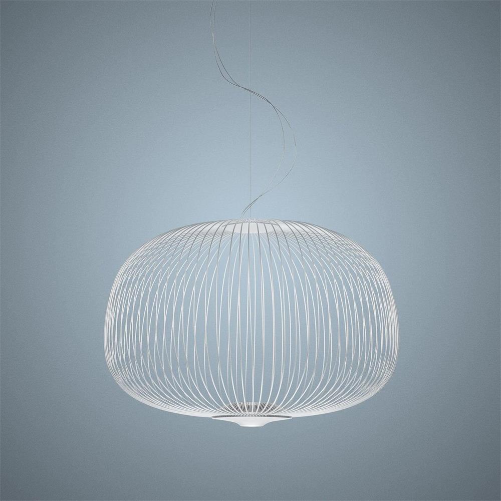 The low, wide drum-shaped wire-cage Clérachic pendant in white, on a pale blue-grey backdrop.
