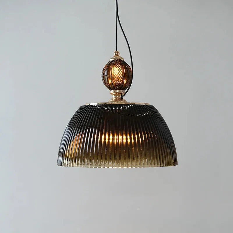 Front view of the Clérachic ribbed smoked-glass pendant, its black adjustable cord looping down to the brass-topped finial.