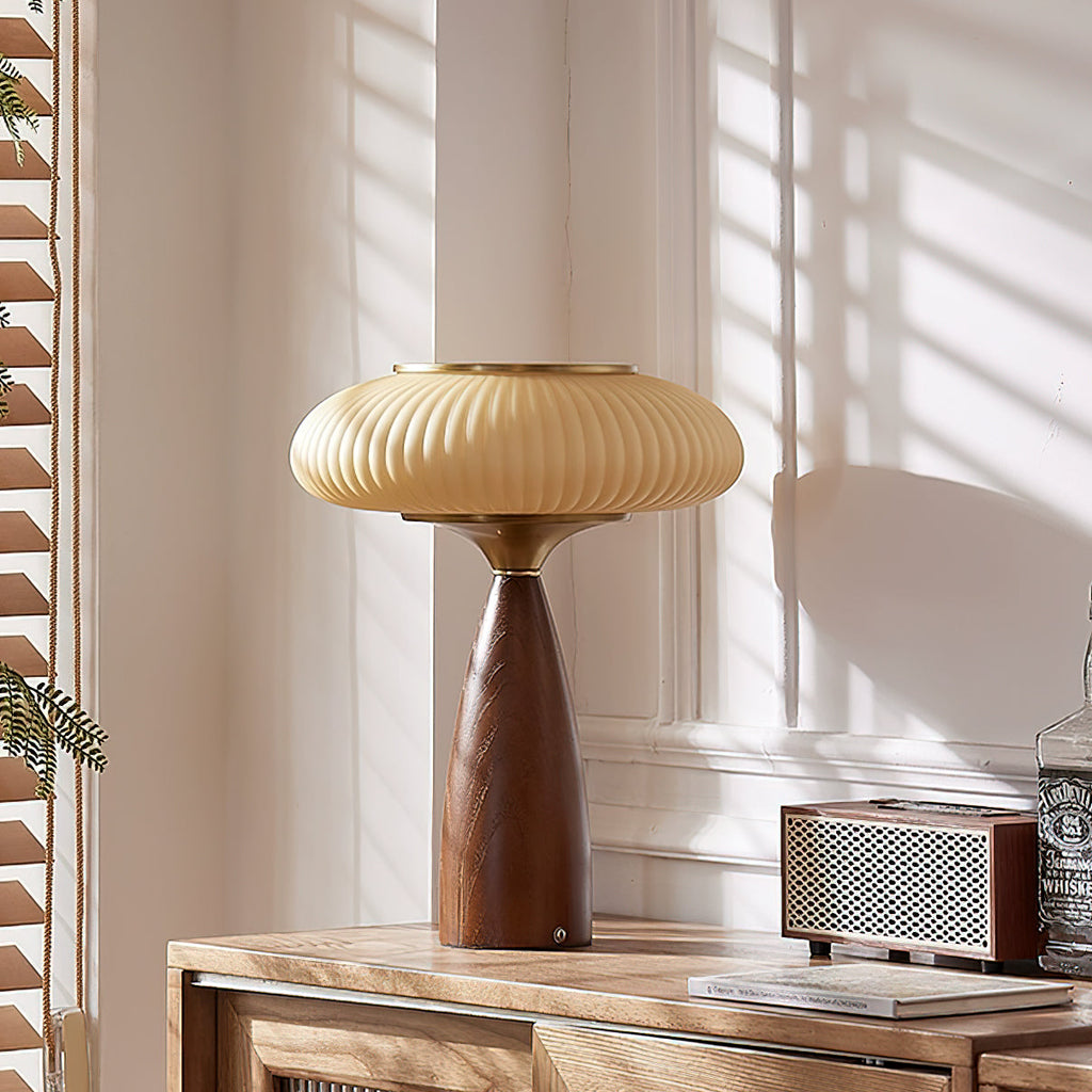 Sunlit corner with this Clérachic table lamp on a sideboard beside a retro speaker, white panelling and wooden blinds.