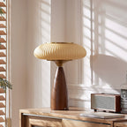 Sunlit corner with this Clérachic table lamp on a sideboard beside a retro speaker, white panelling and wooden blinds.