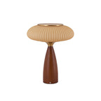 This Clérachic ribbed table lamp with a cinnamon shade on a white backdrop, a brass top over a tapered walnut-colour base.