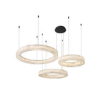 The Clérachic chandelier in three-tier form, three alabaster rings staggered beneath one black canopy.