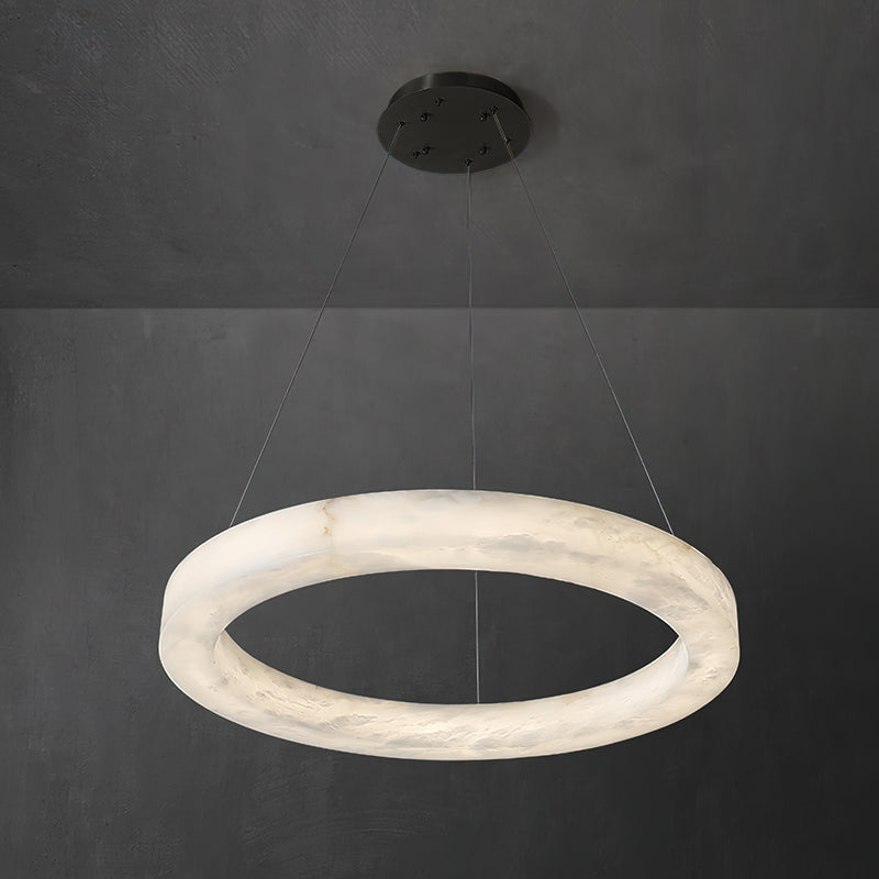Clérachic ring chandelier lit against dark plaster, the black canopy keeping the ceiling fixings discreet.