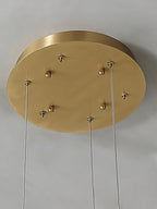 Clérachic brass ceiling canopy close-up, six cable grips and fixing screws set into the round plate.