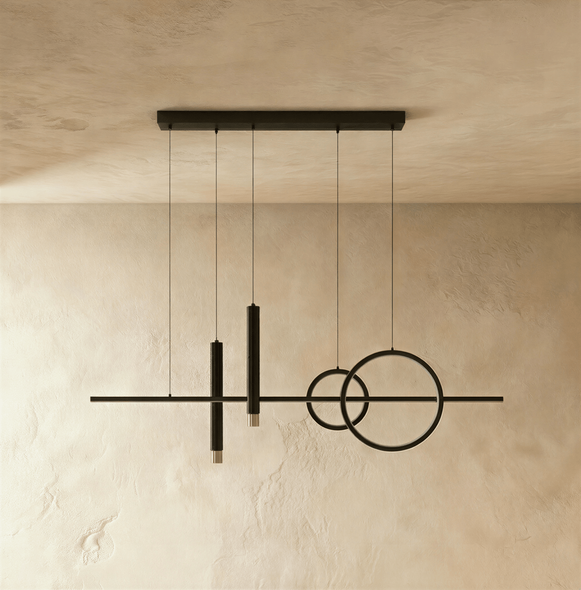 Clérachic matte black pendant light with a bar, two overlapping rings and two spot cylinders, unlit, on a limewash wall.