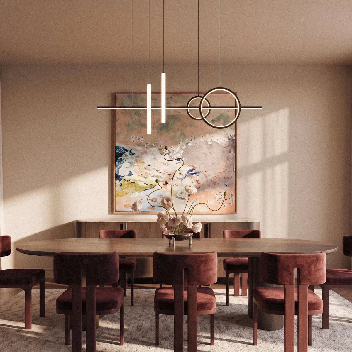 Clérachic black ring and bar pendant light with two frosted tubes hung above a long walnut dining table.