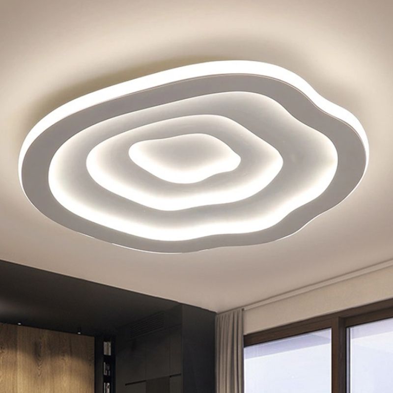 The Clérachic Ripple Spiral seen at an angle on a white ceiling, window daylight at its edge.