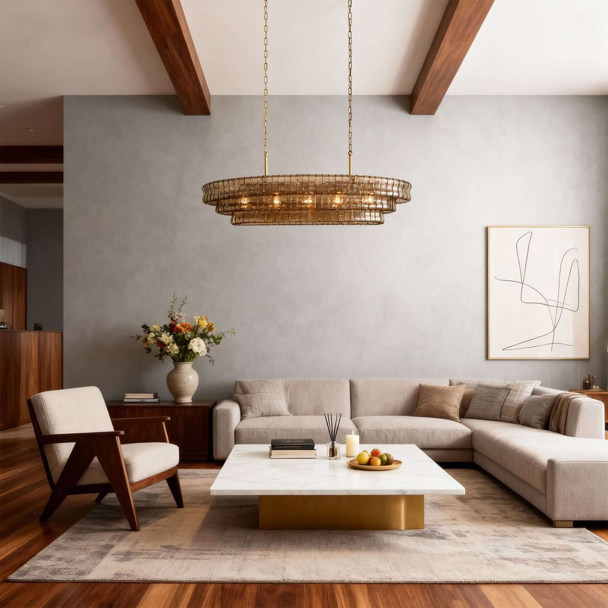 Amber-toned tiers of this Clérachic chandelier hang between exposed beams in a living room with a grey feature wall and cream sofa.