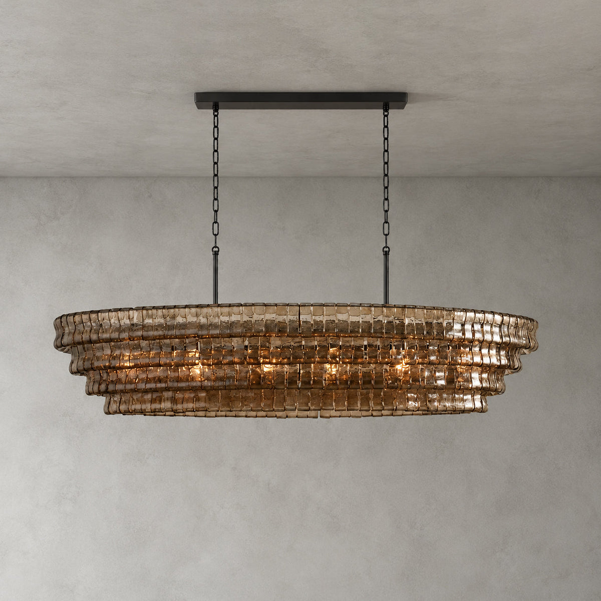 Smoke-grey glass tiers of this Clérachic chandelier hang from a black long canopy bar on black chains, lit on grey.