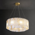 Clérachic Rock chandelier, a drum of alabaster panels studded with brass on dark grey.