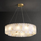 The Clérachic Rock chandelier seen level on grey, its two bands of stone panels lit.