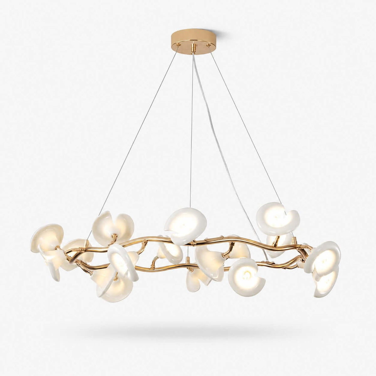 A round Clérachic chandelier with white ceramic petals on a twisting gold-toned metal ring, hung on fine wires from a round canopy.