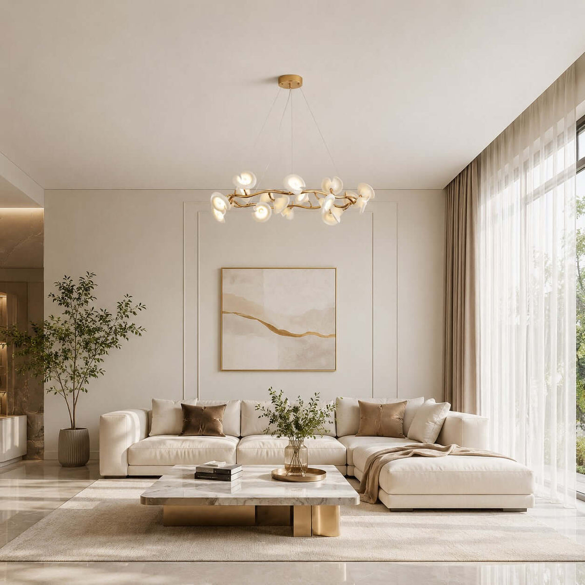 This Clérachic chandelier with gold branches and white petals hangs over a cream sectional sofa and a marble coffee table.