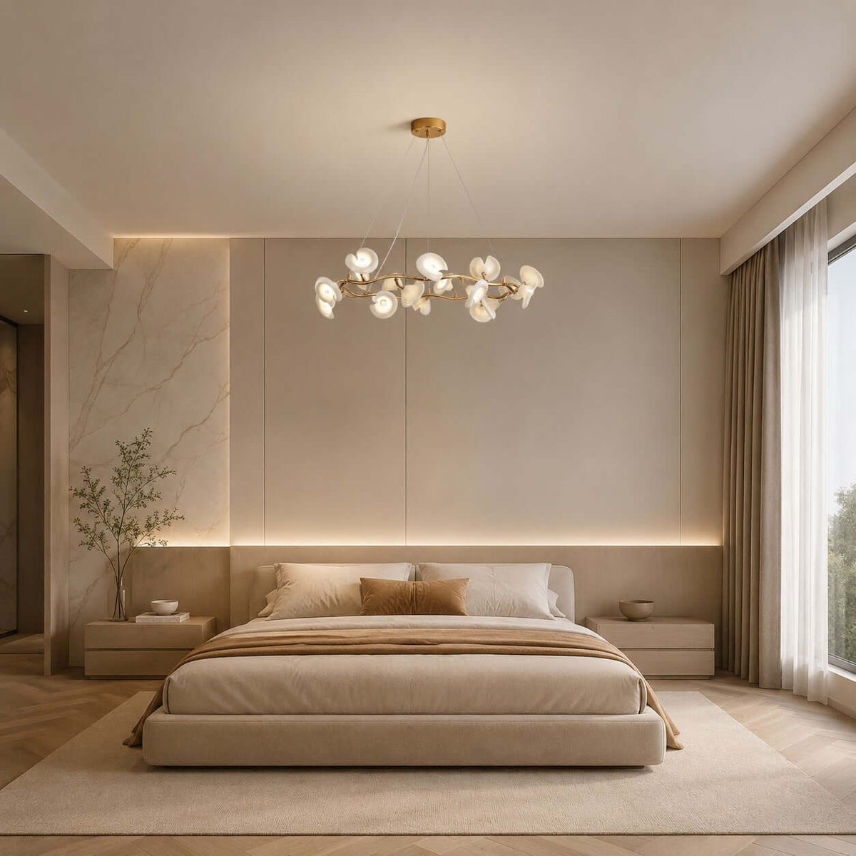 Clérachic round petal chandelier hung in a bedroom with a low upholstered bed, a marble wall panel and a strip of warm light.