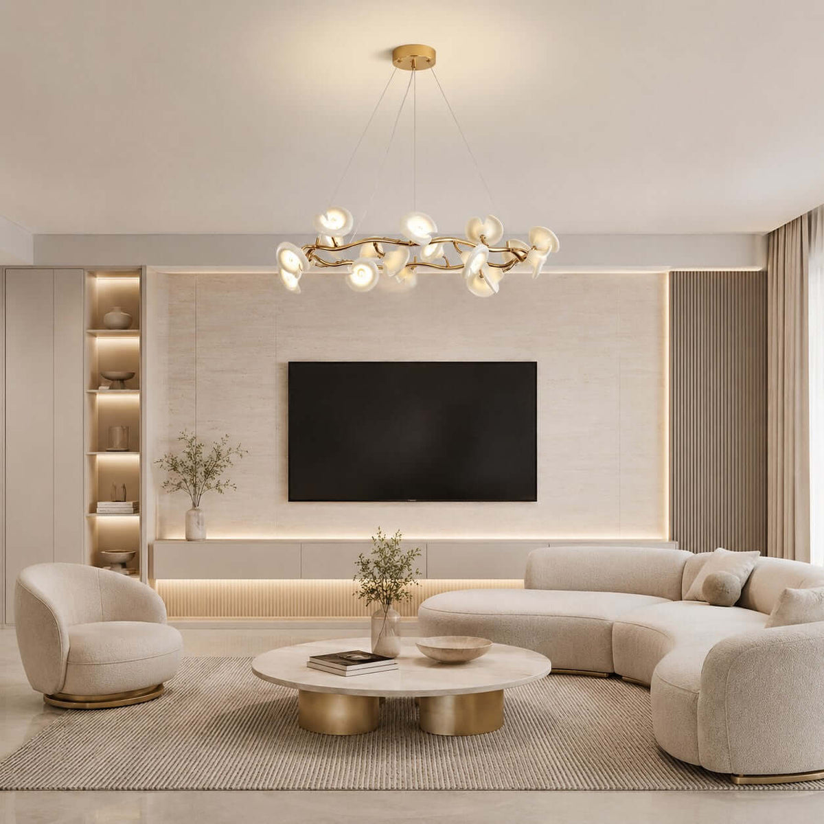 A lit Clérachic ceramic petal chandelier above a living room with a curved sofa, a swivel chair and a wall-mounted TV.