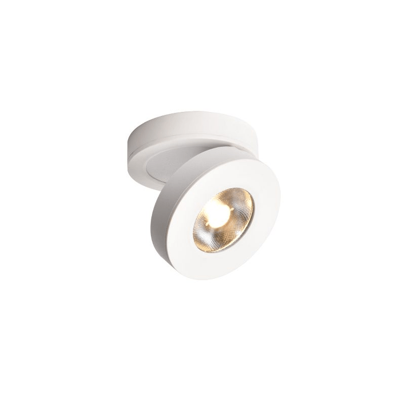 This Clérachic white spotlight on a plain white backdrop, with its disc head tilted and its LED glowing inside a ribbed reflector.