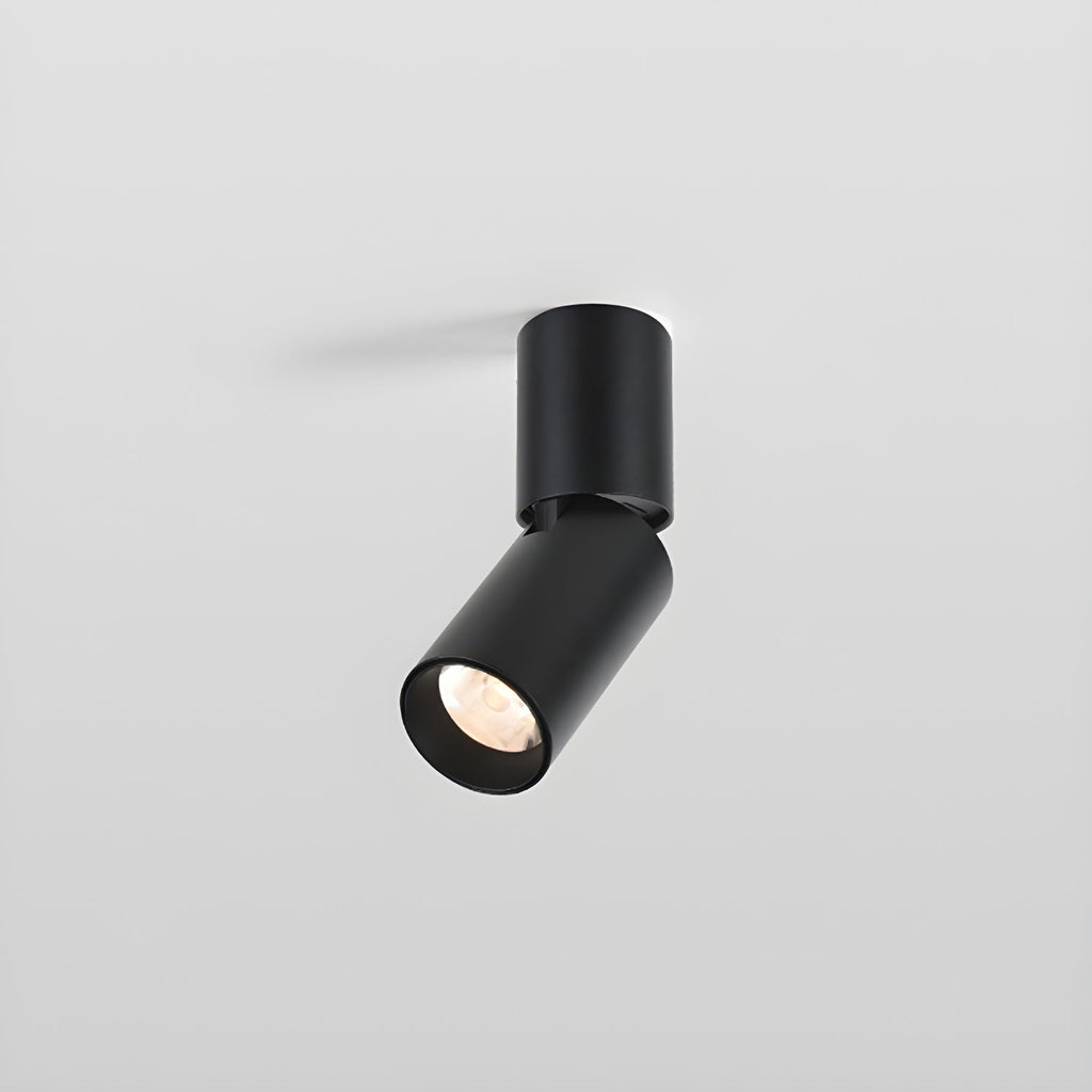A short black Clérachic spotlight with an angled head, its lens showing a faceted reflector, on a light grey backdrop.