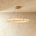 Clérachic single-ring alabaster chandelier, its glowing band suspended on cords from a round ceiling canopy.