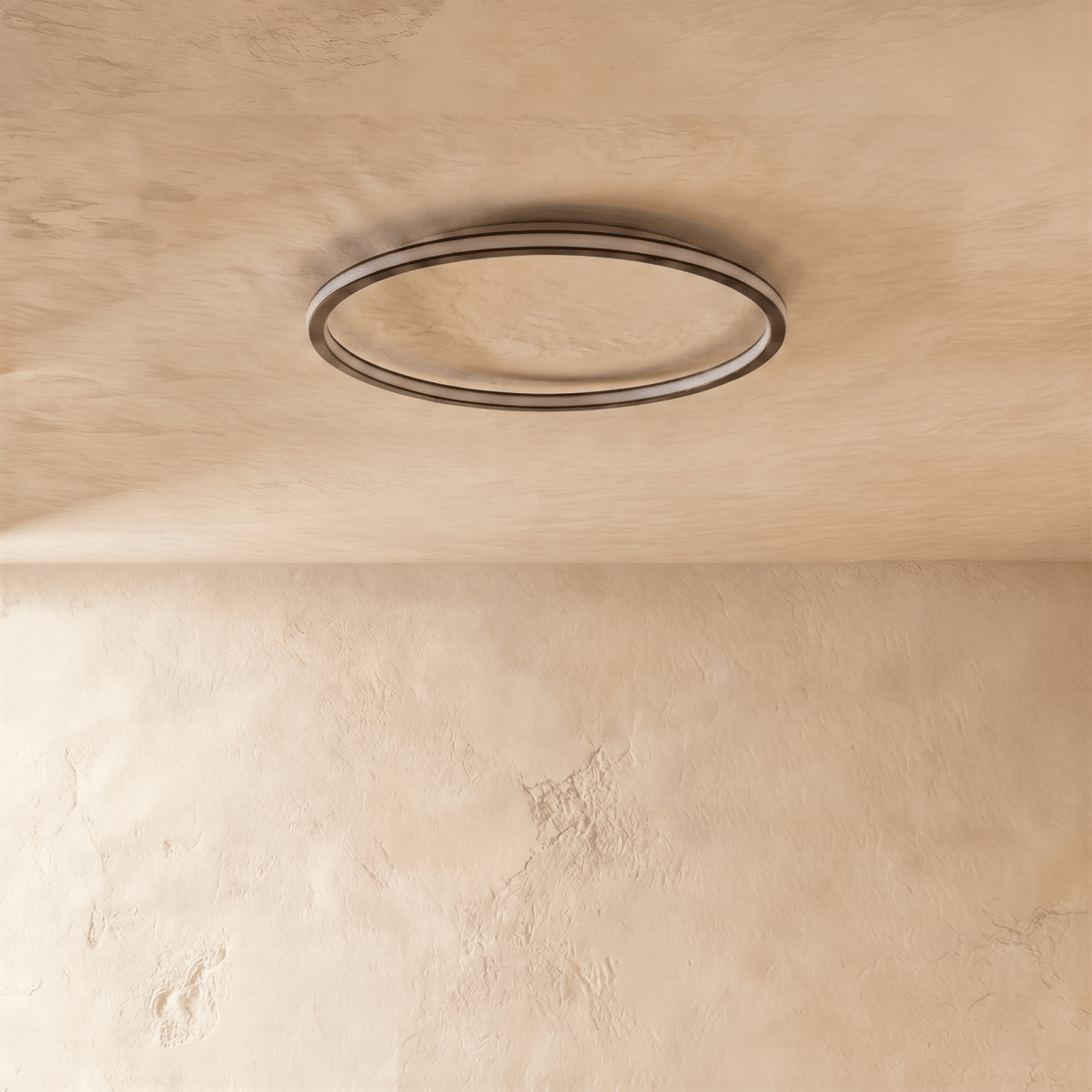 A side view of the Clérachic matte black ceiling ring, its slim profile sitting flush against a plaster ceiling.