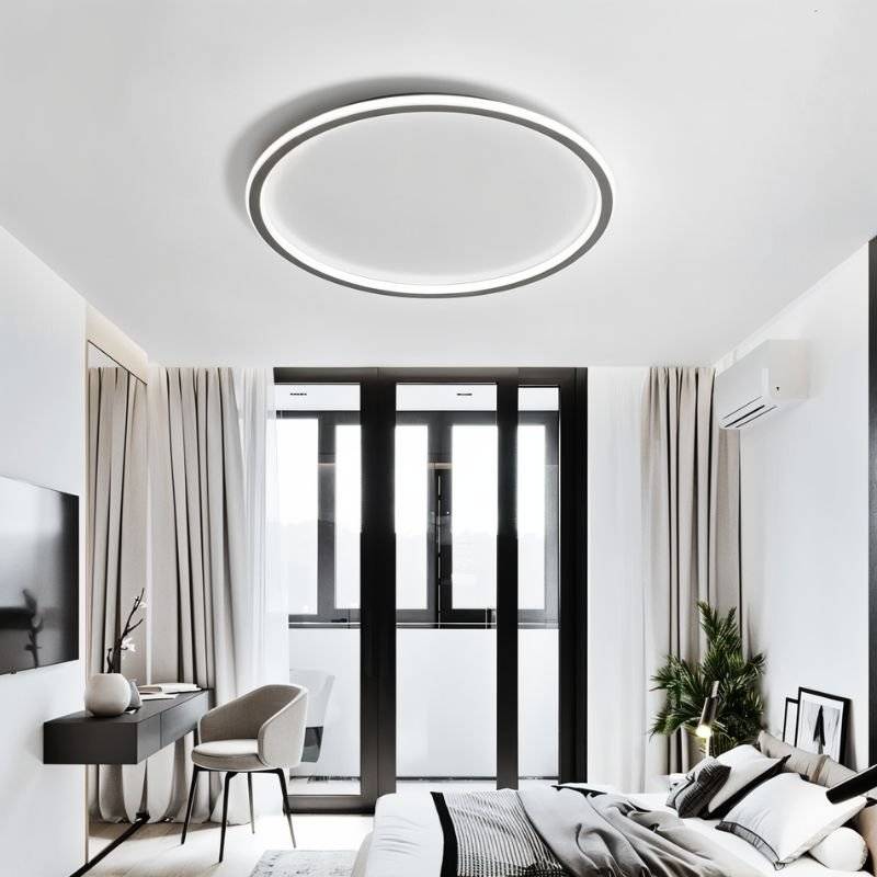The Clérachic matte black ceiling ring lights a bedroom with dark-framed balcony doors and sheer curtains.