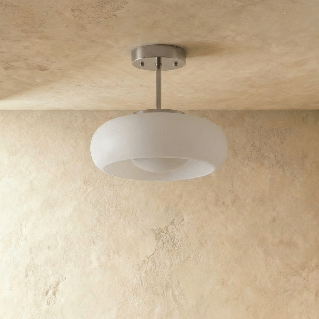 Clérachic semi-flush pendant with a rounded white glass shade on a short brushed chrome stem, shown unlit.