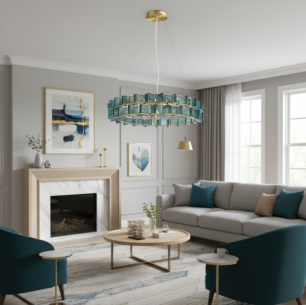 Over a round coffee table, this blue Clérachic chandelier hangs beside a white marble fireplace and teal armchairs.