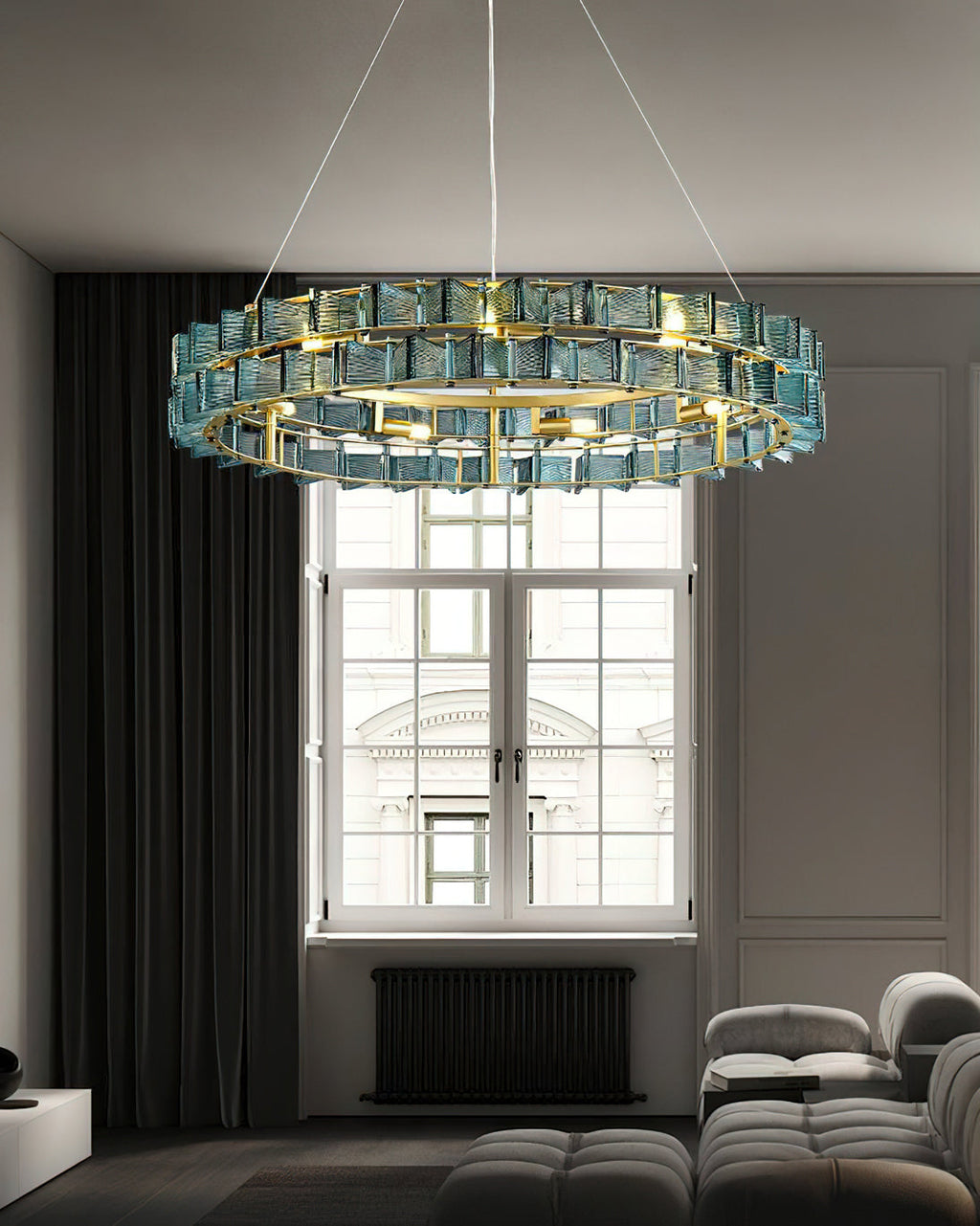 Blue ribbed glass blades glow on this Clérachic chandelier, hung high in a grey room with a tall window and a black radiator.