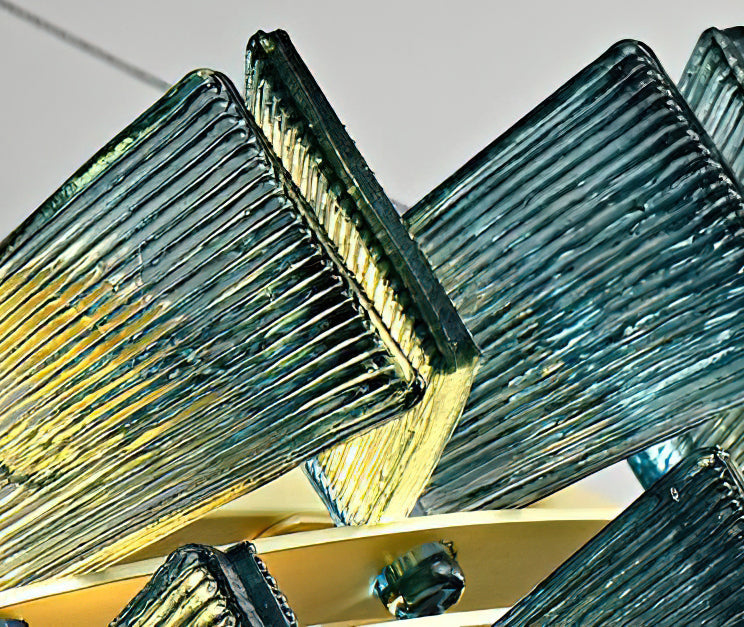 Very close view of the vertical ribbing on a blue glass blade from this Clérachic chandelier, lit from within.