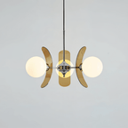 Clérachic three-globe chandelier with curved brown acrylic petals and white glass balls on a chrome hub