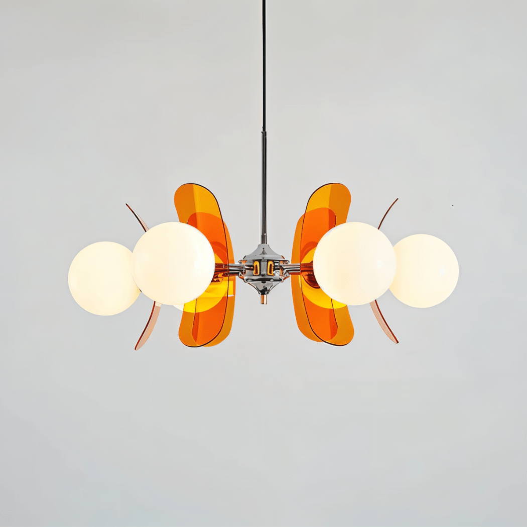 Clérachic chandelier with opal globes and glowing orange acrylic petals fanned out from a chrome hub