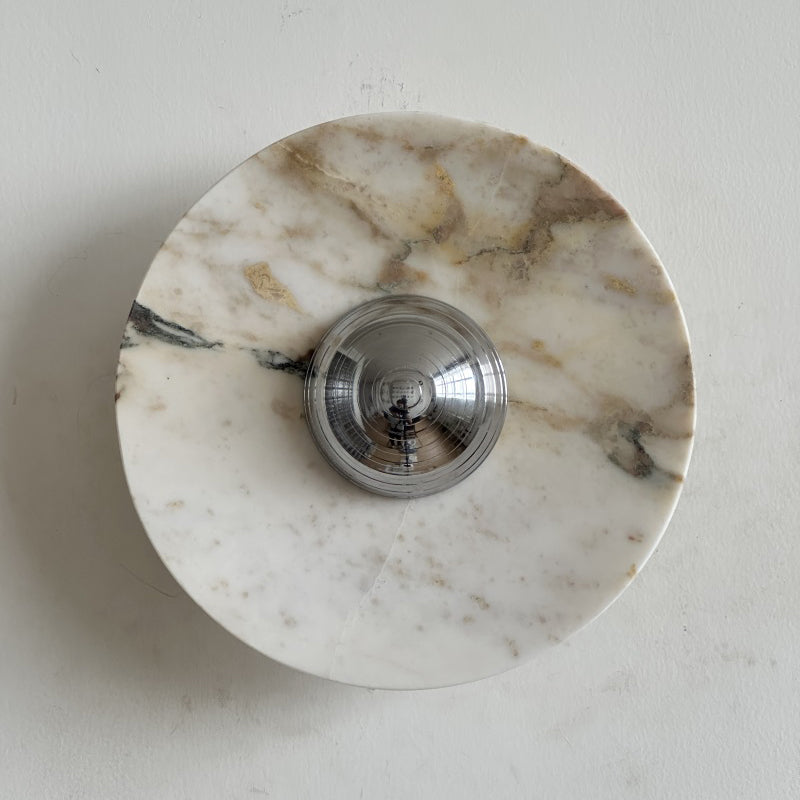 Warm cream and honey stone with green-grey veins makes this Clérachic marble wall light, with a polished chrome dome centred on it.