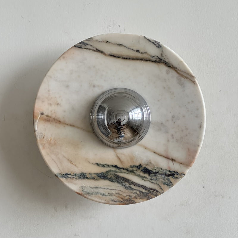 Long dark veins at the top and bottom and a blush tint across the middle mark this Clérachic marble wall light.