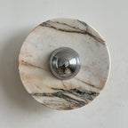 Long dark veins at the top and bottom and a blush tint across the middle mark this Clérachic marble wall light.