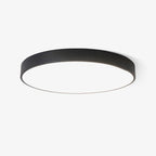 Black round slimline LED ceiling light from Clérachic with a flat white diffuser, shown on a plain white background.