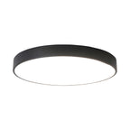 Black round Clérachic ceiling light with a slim straight rim and a flat white diffuser, on white.