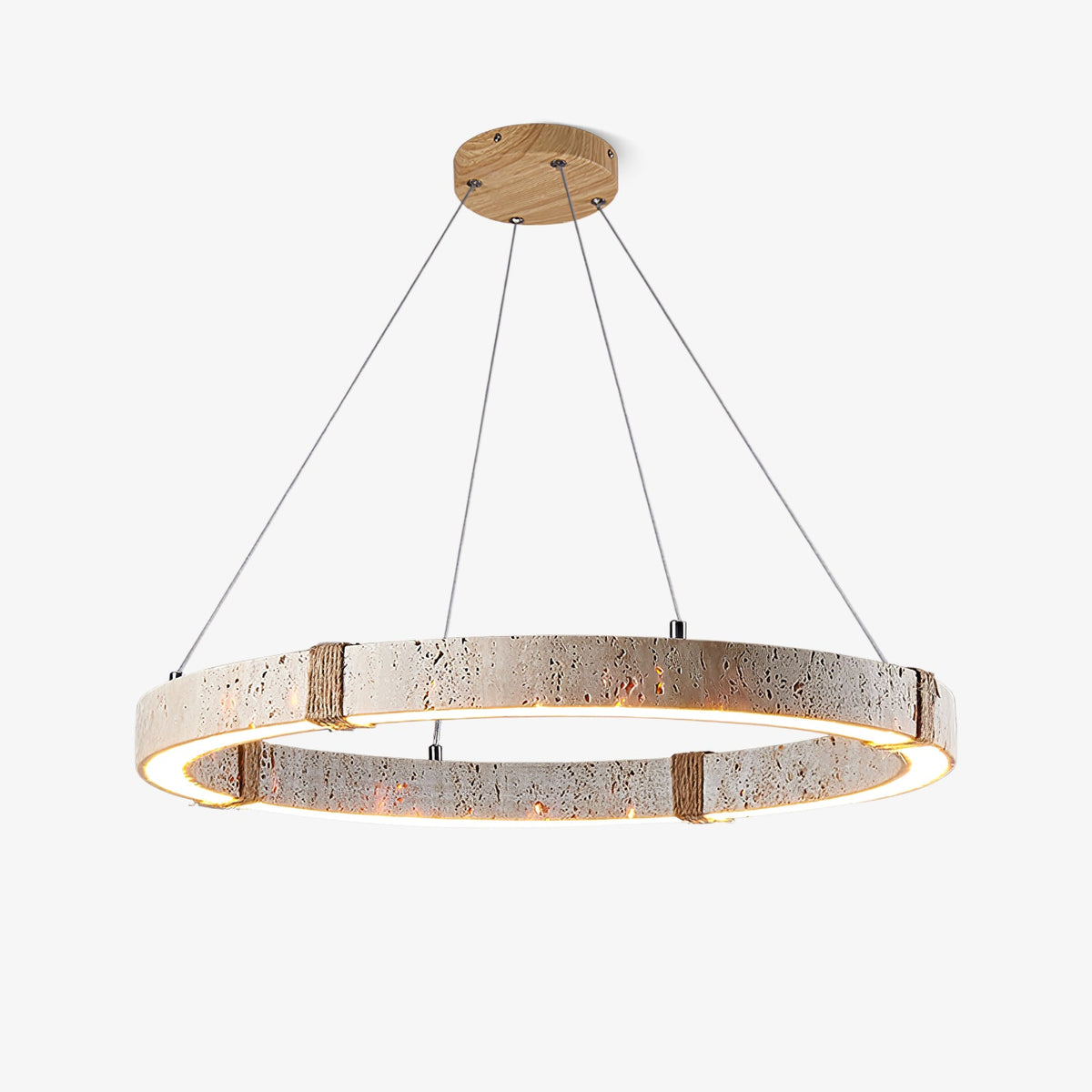 Round travertine ring pendant from Clérachic on a wooden ceiling plate, with a warm LED glowing from the inner edge, on a plain white backdrop.