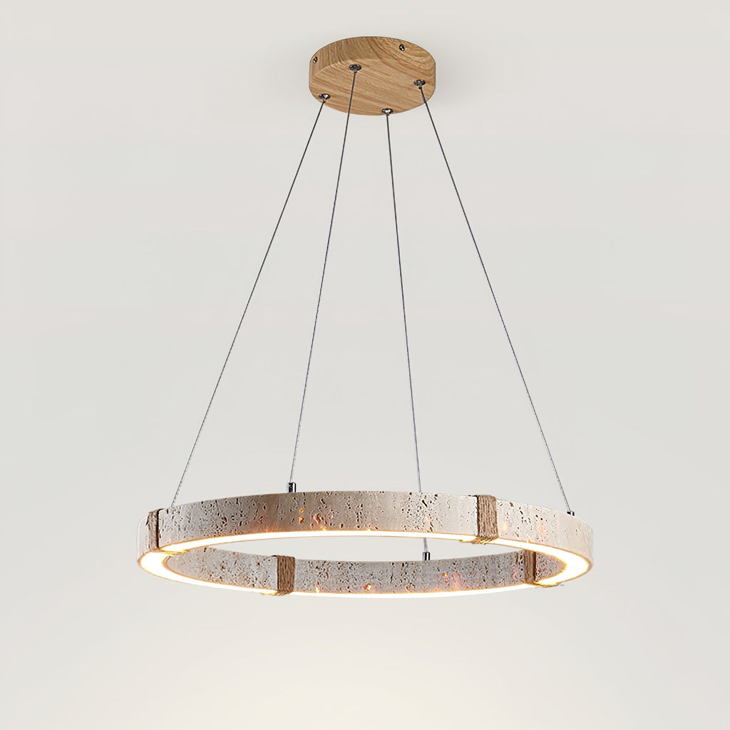 Travertine ring pendant from Clérachic seen at a lower angle, with a glowing inner edge and four rope-wrapped joints.