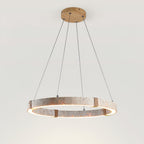 Travertine ring pendant from Clérachic seen at a lower angle, with a glowing inner edge and four rope-wrapped joints.